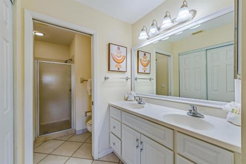 a bathroom with a sink and a mirror and a toilet at Spacious Shorewalk 2B-2B Condo near Anna Maria Island, Beaches & IMG Academy in Bradenton