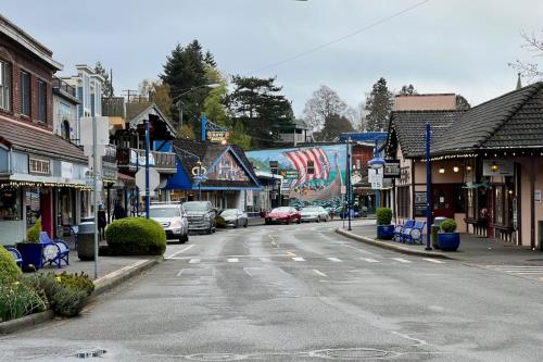 an empty street in a small town with cars parked at Puget Sound Orca Retreat in Poulsbo