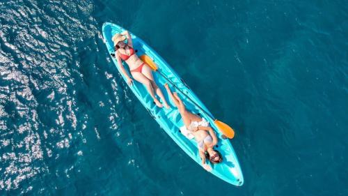 two people on a kayak in the water at Travel Light Bubble Diving Center in Xiaoliuqiu