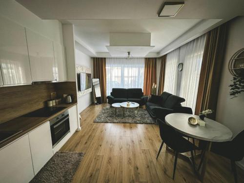 a living room with a couch and a table at Apartman Zdravko in Tomislavgrad