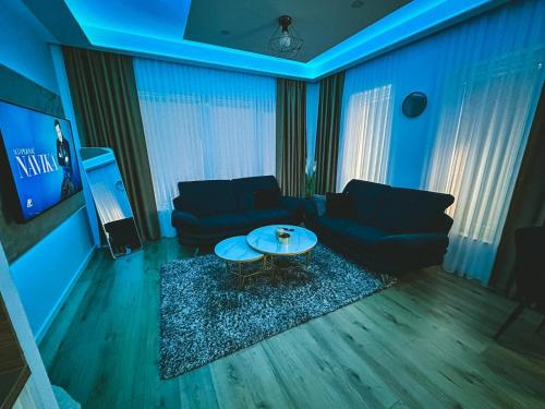 a living room with a couch and a table at Apartman Zdravko in Tomislavgrad