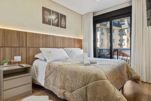 Ένα ή περισσότερα κρεβάτια σε δωμάτιο στο Leev Home 2 dorm 50m Rua Coberta by Achei Gramado