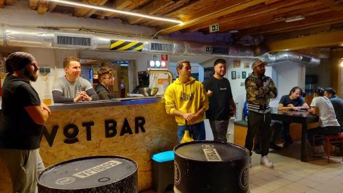 a group of men standing around a wet bar at WOT New Lisbon in Lisbon