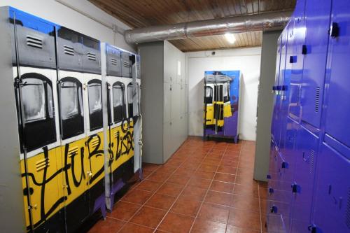 a room with blue and yellow doors and a tile floor at WOT New Lisbon in Lisbon
