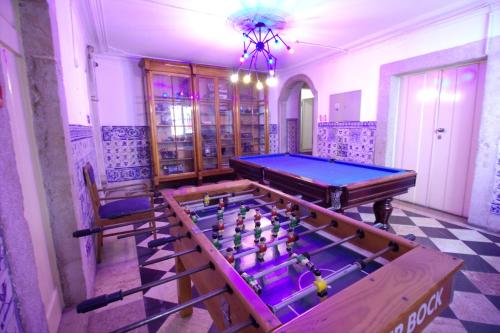 a room with a ping pong table and two chairs at WOT New Lisbon in Lisbon
