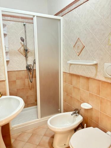 a bathroom with a shower and a toilet and a sink at Casa Josefina in Sant'Angelo D'Ischia