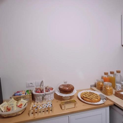 a kitchen counter with some food on a table at Casale Trifoglio in Morano Calabro