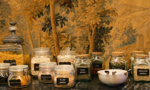 a group of jars of food sitting on a table at Casa Vela Boutique House in Cascais