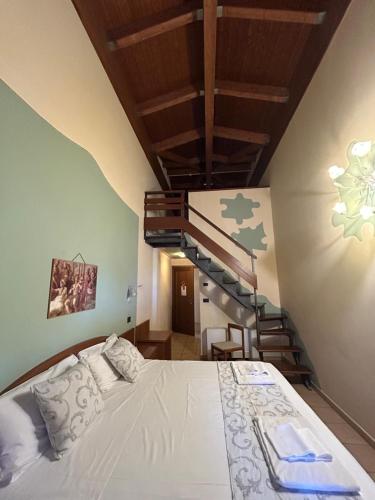 Postel nebo postele na pokoji v ubytování Hotel Duca Della Corgna