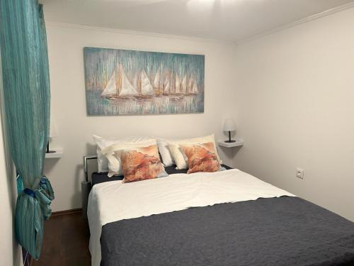 Ένα ή περισσότερα κρεβάτια σε δωμάτιο στο Apartman Mornar