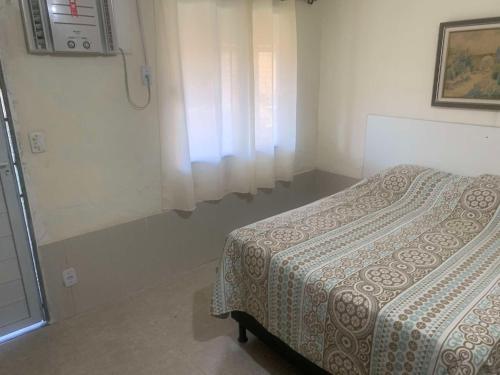 Postel nebo postele na pokoji v ubytování Pousada dos amigos