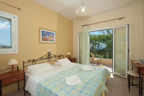 Ένα ή περισσότερα κρεβάτια σε δωμάτιο στο Trapezaki Villas