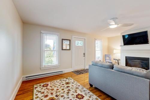 a living room with a couch and a fireplace at Town of Lewes --- 138 Washington Ave, Unit A in Lewes