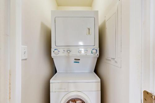 a white washer and dryer in a room at Town of Lewes --- 138 Washington Ave, Unit A in Lewes