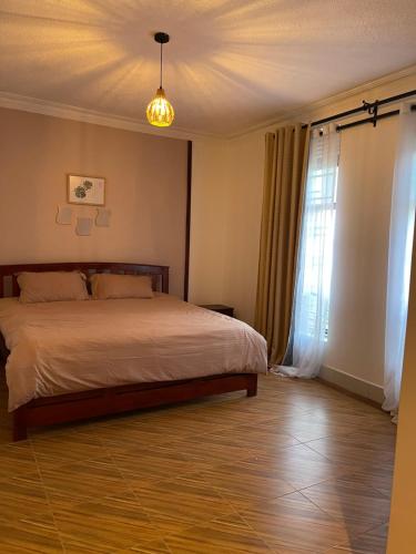 Llit o llits en una habitació de BAZY SUITEs