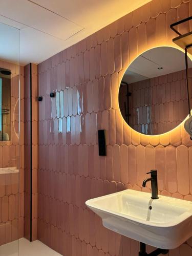 a bathroom with a sink and a mirror at Apartamentos Sofía in Es Cana