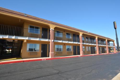 an empty street in front of a building at Super 8 by Wyndham Midwest City OK in Midwest City