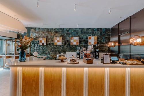 a kitchen with a counter with food on it at Club Quarters Hotel St Paul's, London in London