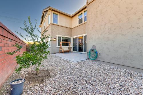 a house with a patio in front of it at Patio and Balcony Spacious Gilbert Getaway! in Gilbert
