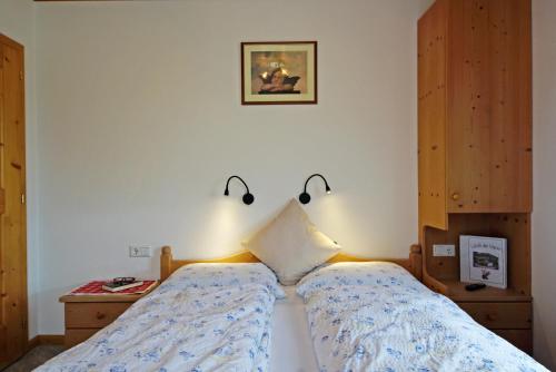 Postel nebo postele na pokoji v ubytování Agriturismo Lüch de Vanc
