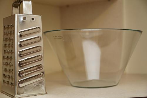 a glass bowl sitting on a counter next to a appliance at Melissa Apartman in Balatonfüred