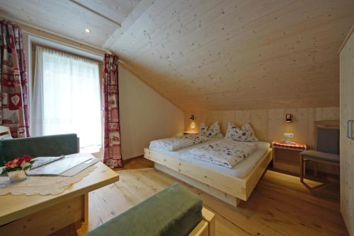 Postel nebo postele na pokoji v ubytování Agriturismo Lüch de Vanc