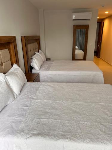 Postel nebo postele na pokoji v ubytování Hotel Concordia