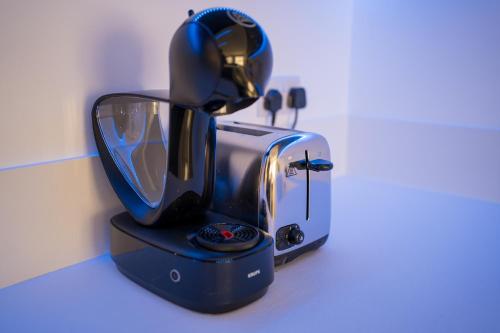 a coffee maker sitting on top of a counter at Luxury brand new holiday apartments TOP location in Is-Swieqi