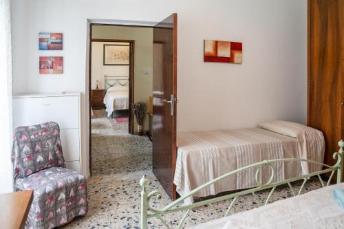 Ένα ή περισσότερα κρεβάτια σε δωμάτιο στο Casa Nonna Ica