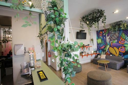 a room with potted plants on the wall in a store at WOT Lisbon Patio in Lisbon