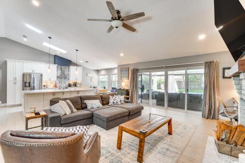 a living room with a couch and a table at Screened Lanai and Fenced Yard Luxe Orlando Home in Orlando