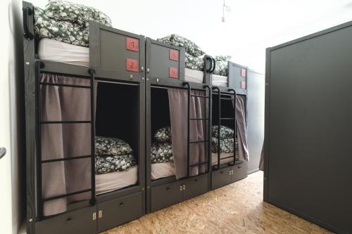 a bunk bed with four bunk beds in a room at WOT Lisbon Patio in Lisbon
