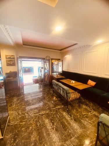 a living room with a table and a couch at Adora Hotel in Istanbul
