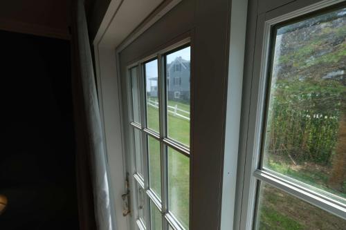 a window with a view of a yard at The Beach House Inn in Kennebunk