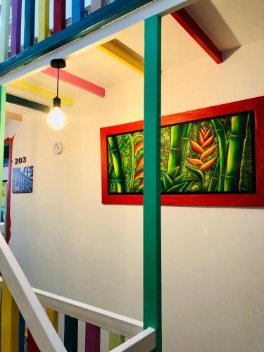 a staircase with stained glass windows in a building at Hotel Café Color in Armenia