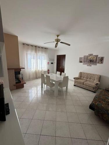a living room with a table and a couch at Sunshine Alloggio turistico in Capodimonte