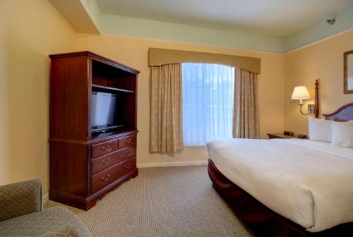 a hotel room with a bed and a television at Senator Inn & Spa in Augusta