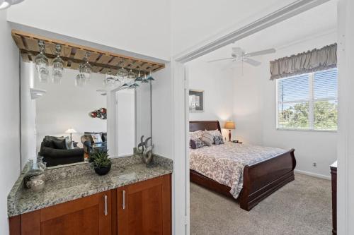 a bedroom with a bed and a large mirror at St Pete Vista Verde East 3 223 Spectacular Unit in Point Brittany