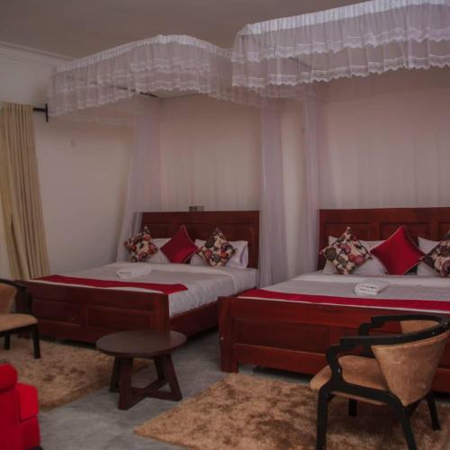 Postel nebo postele na pokoji v ubytování Fortpearls Homestay