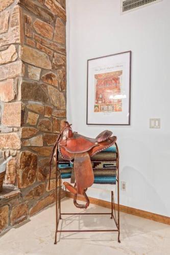 a saddle sitting on top of a pile of books at Sunrise Oasis your Western Oasis in the Desert in Fountain Hills