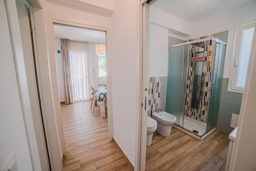 a bathroom with a toilet and a sink at Villa Capri in Campofelice di Roccella