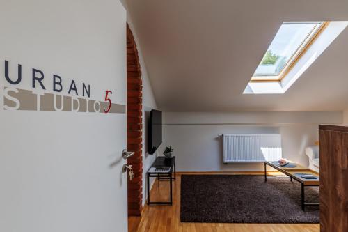 a skylight in a living room with a window at UrbanStudio5 in Čakovec