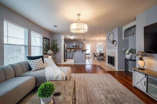 a living room with a couch and a table at Cozy 3 bedrooms House - Feel Like Home in Houston