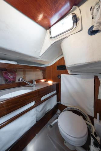 a bathroom with a toilet and a sink at Sleep and Sail - Marina de Oeiras - Lisbon's coast in Oeiras