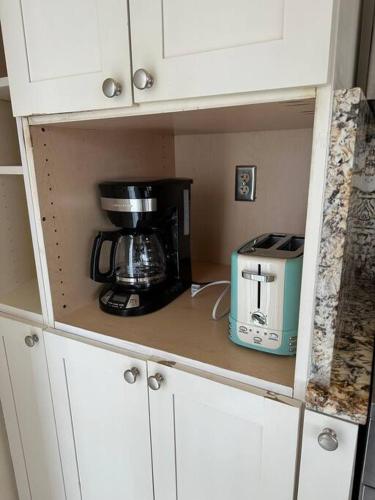 a kitchen cabinet with a blender and a toaster at The Escape Pod Cheat Lake, Morgantown, Hot Tub, 2Bed, 2Bath in Morgantown