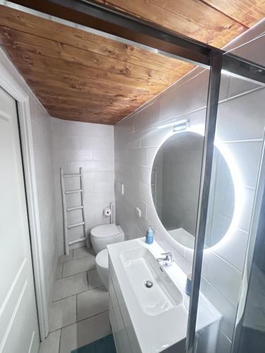 a bathroom with a sink and a toilet at Leandra Apartment in Civitavecchia