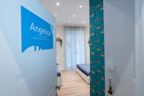 a room with a door with a blue sign on it at Vittorio Emanuele Suite in Castellammare di Stabia
