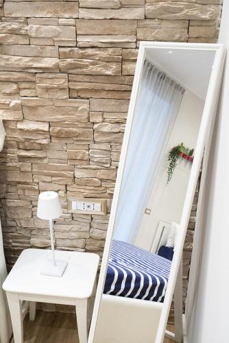 a room with a bunk bed with a mirror at Vittorio Emanuele Suite in Castellammare di Stabia