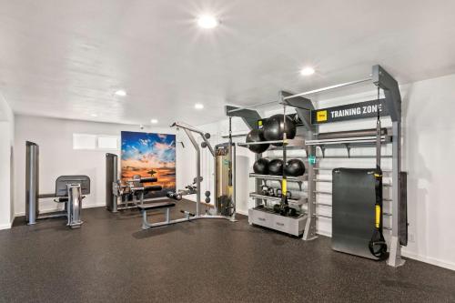 a fitness room with a gym with a simulator at Aston Maui Kaanapali Villas in Lahaina