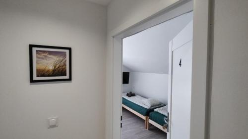 Postel nebo postele na pokoji v ubytování Apartamenty Na Plażowej